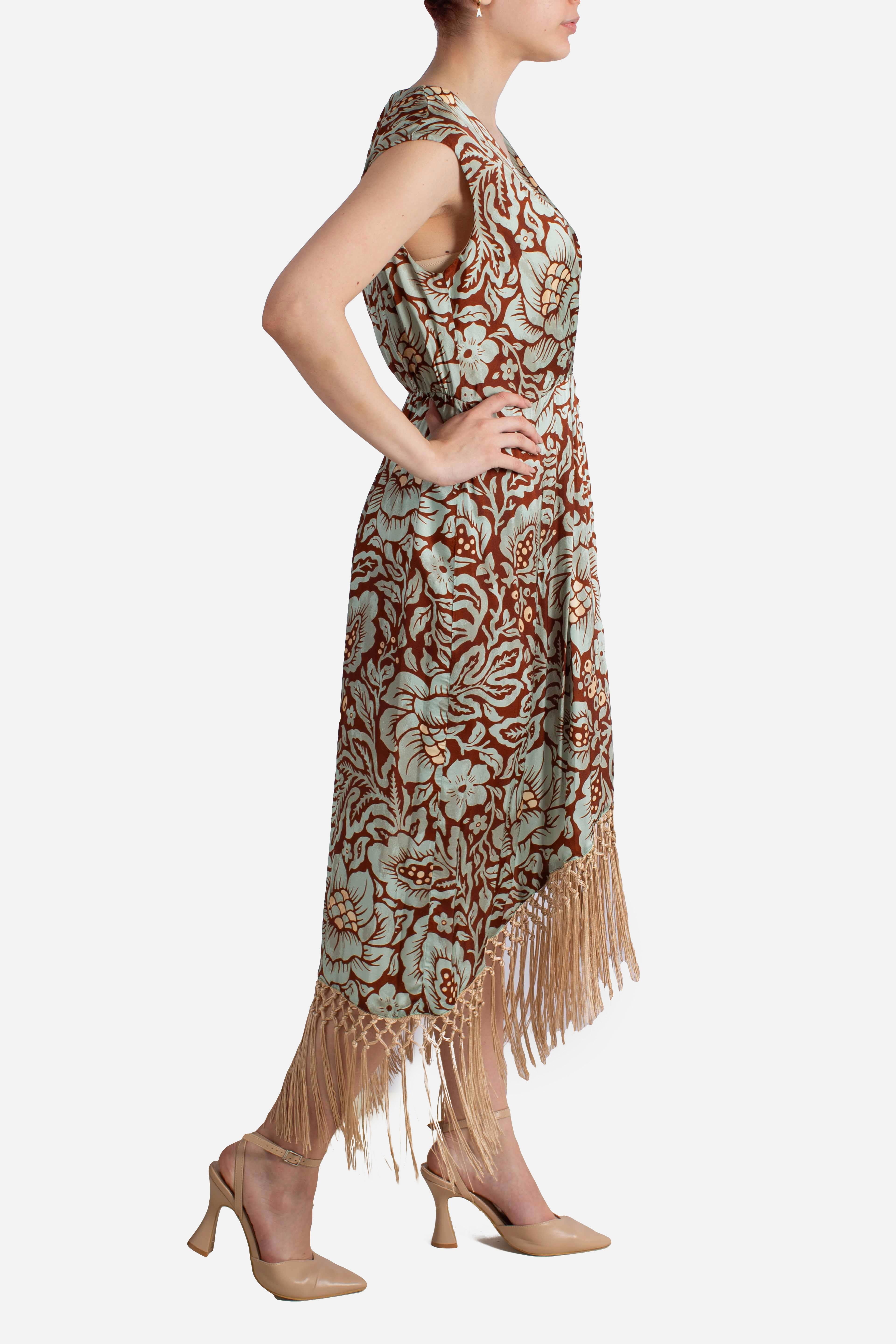 Abito lungo fantasia floreale con frange