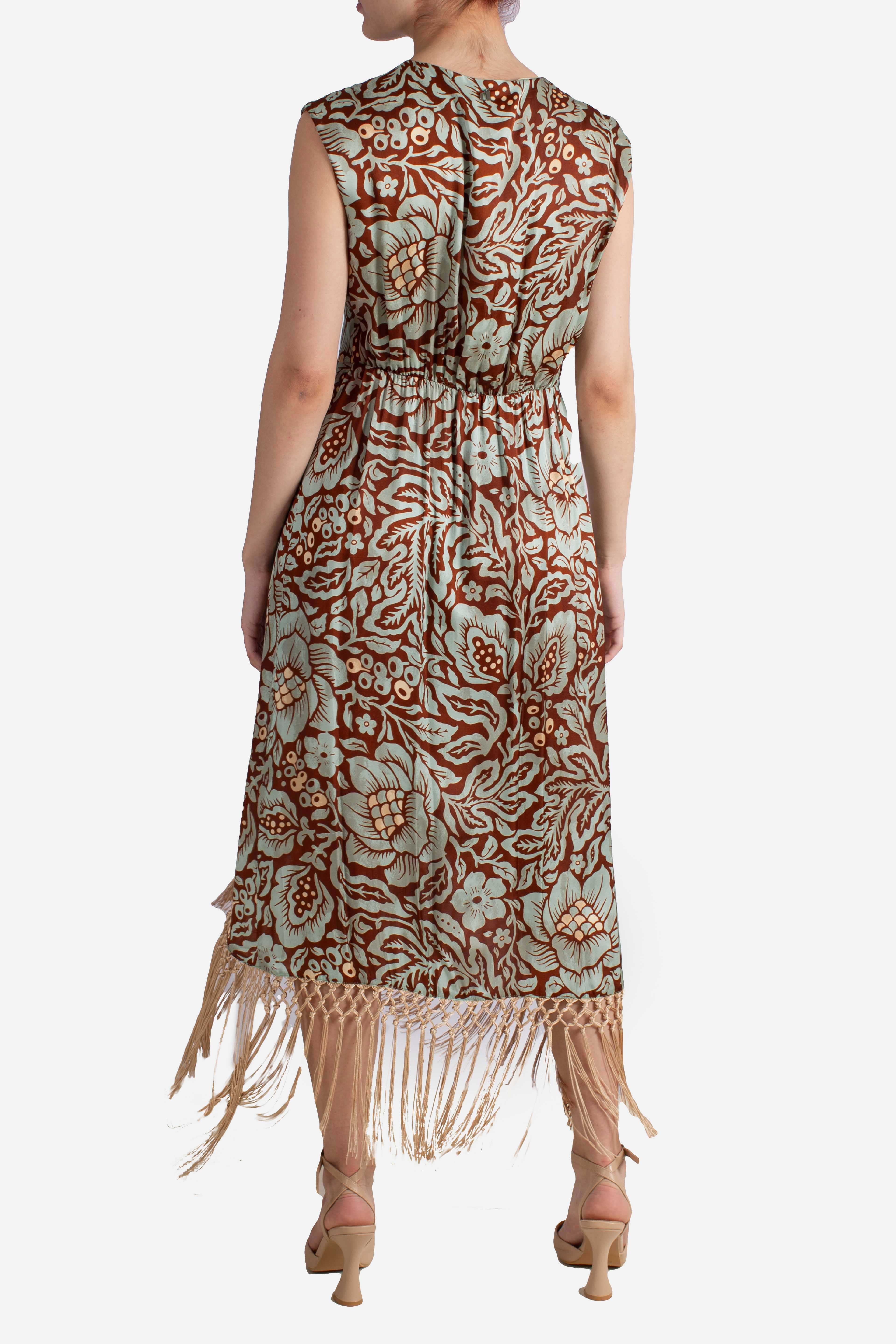 Abito lungo fantasia floreale con frange