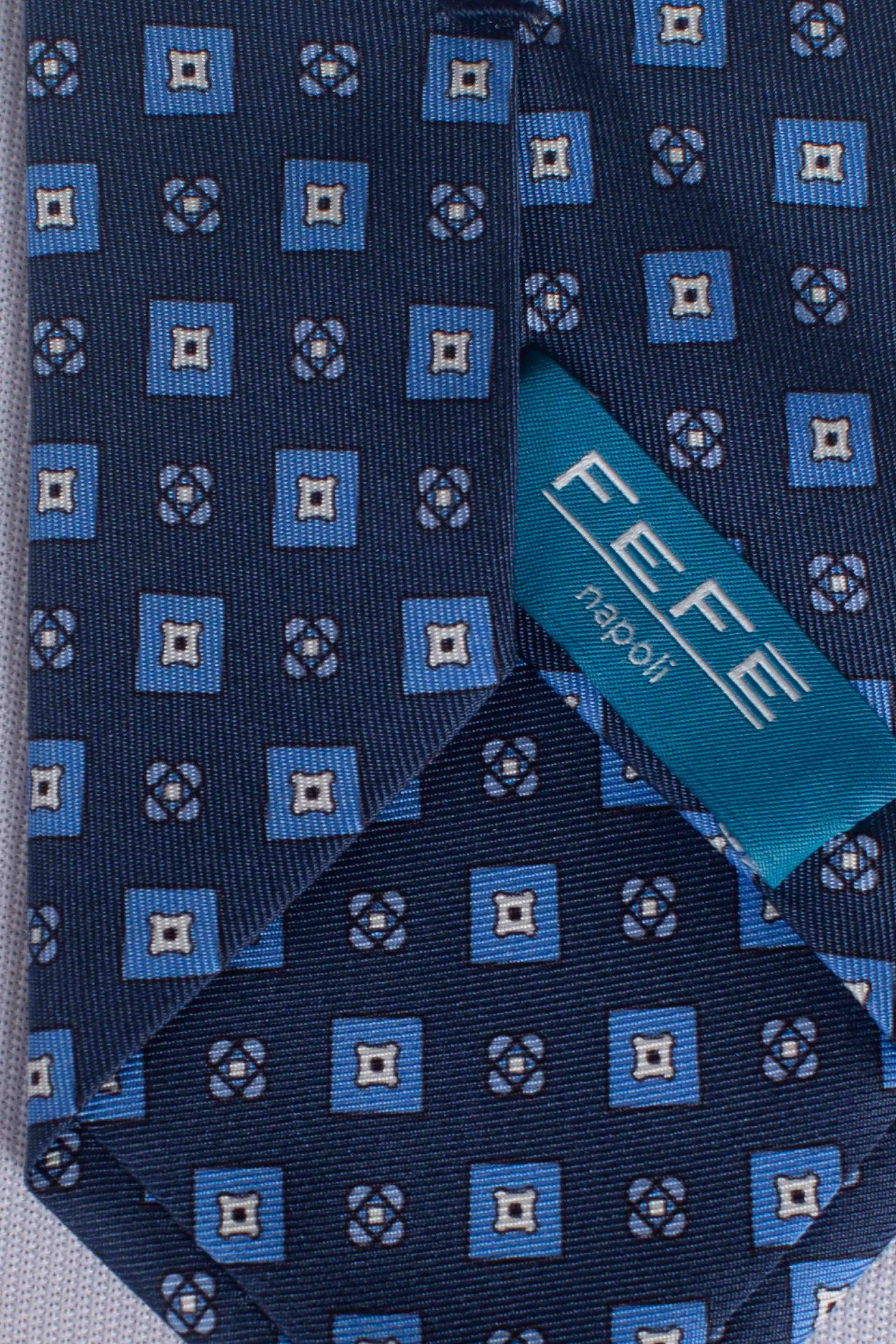 Cravatta in seta rombi fiori blu