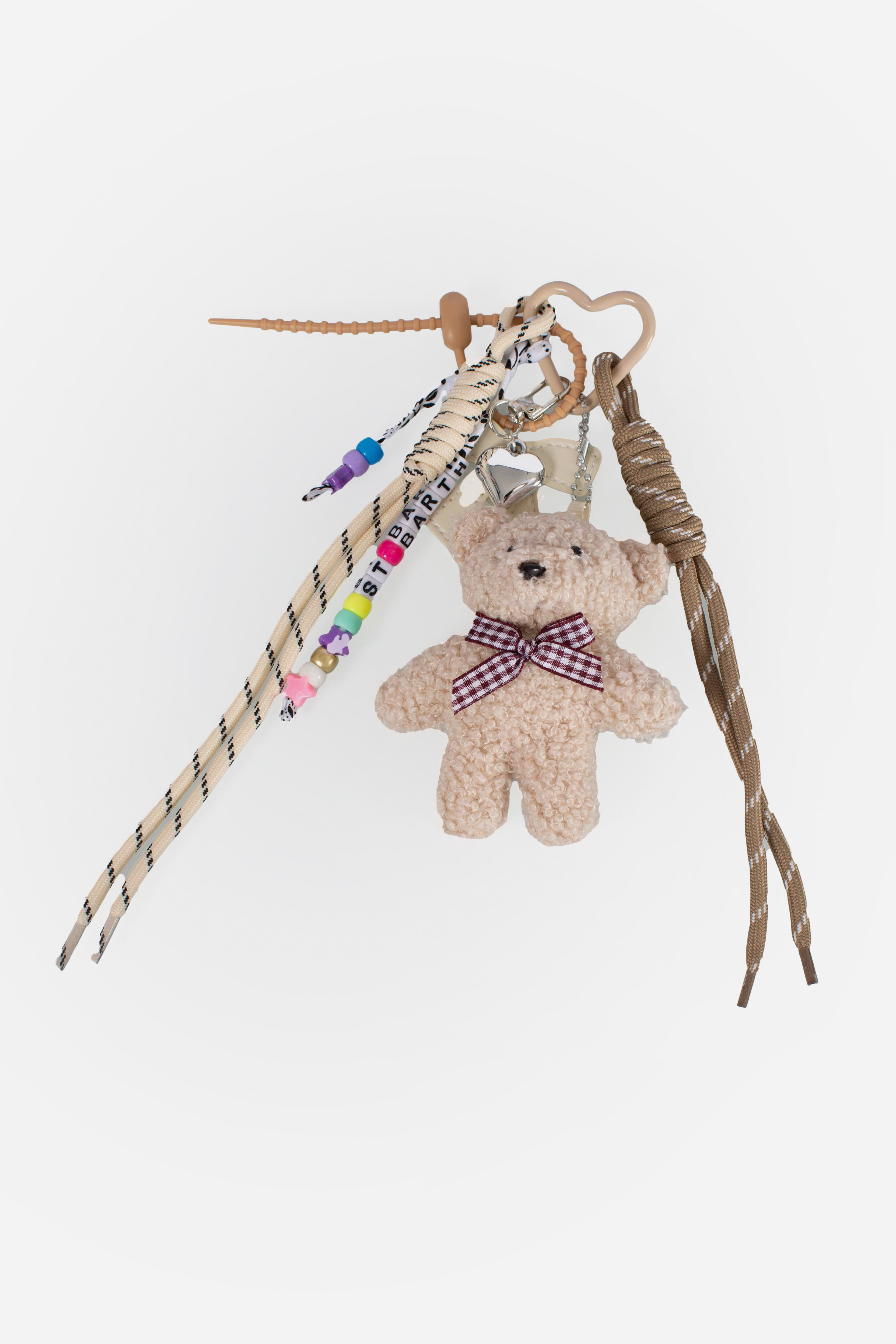 Funny Charm con fiocco imbottito e teddy decorativo