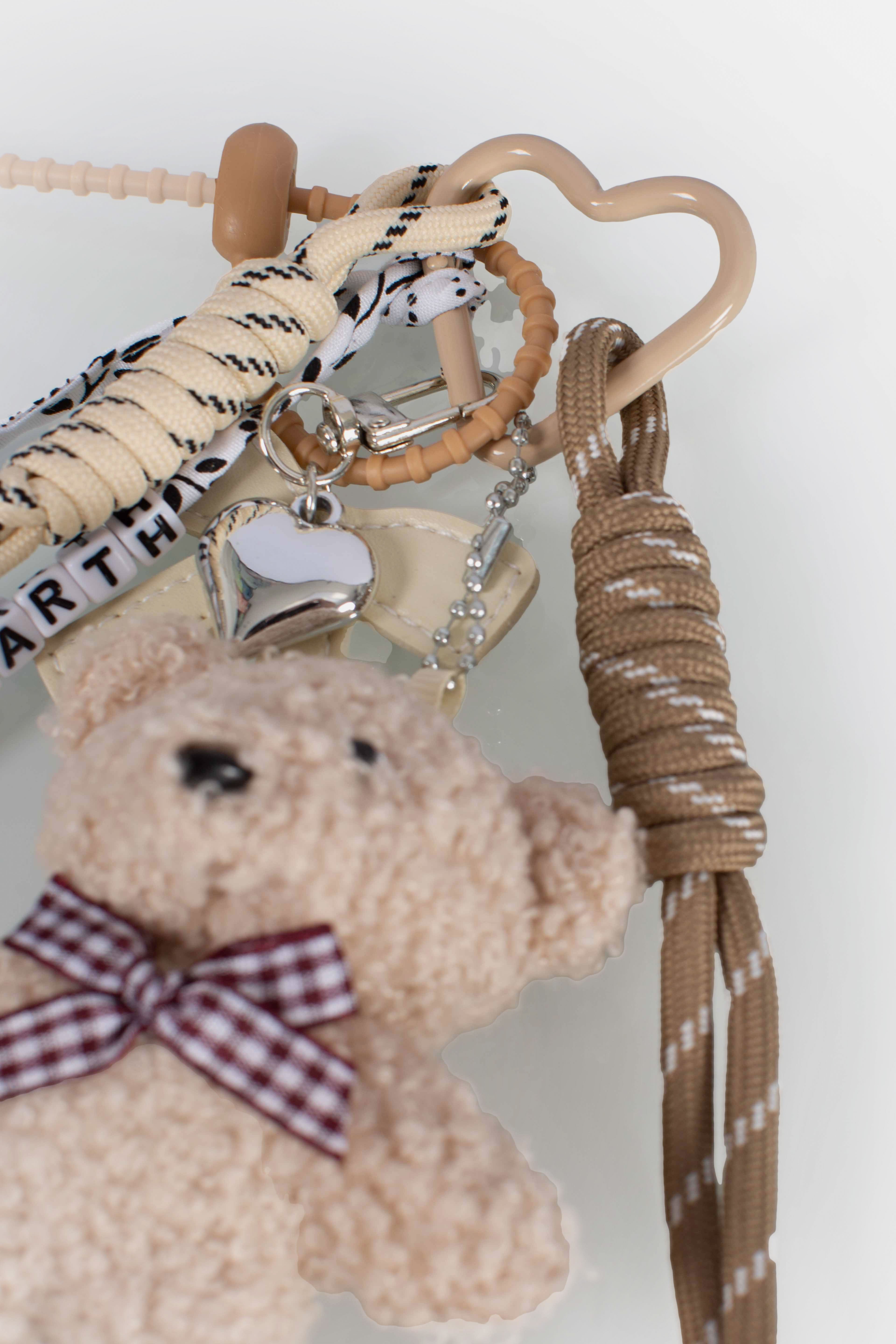 Funny Charm con fiocco imbottito e teddy decorativo